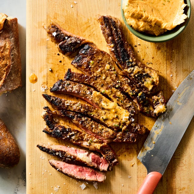 juicy ribeye steak basted and served with zesty spicy butter