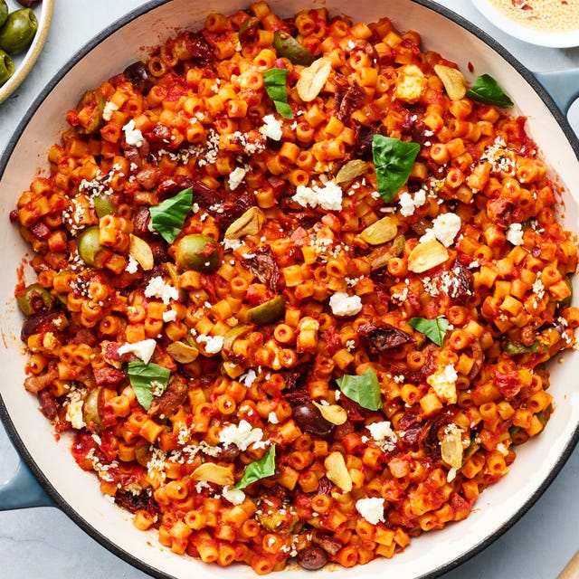 spicy ditalini pasta with sun dried tomatoes, basil, garlic olives, chopped anchovies, chiles, and crumbled feta