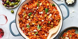 spicy ditalini pasta with sun dried tomatoes, basil, garlic olives, chopped anchovies, chiles, and crumbled feta