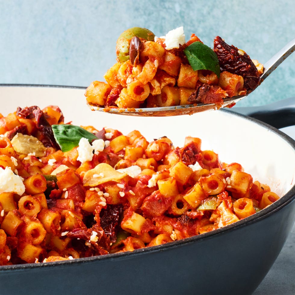 spicy ditalini pasta with sun dried tomatoes, basil, garlic olives, chopped anchovies, chiles, and crumbled feta