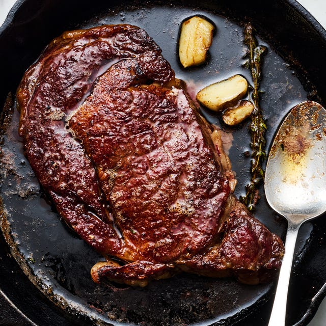 reverse sear steak in a cast iron skillet with garlic and thyme