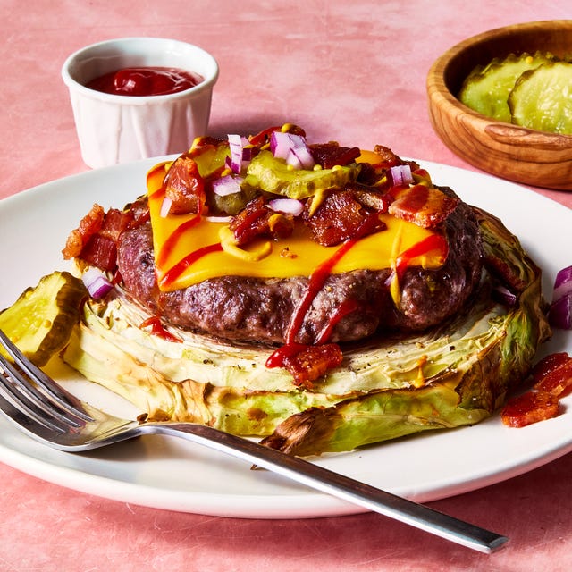 roasted cabbage burger topped with american cheese, pickles, red onion, bacon, ketchup, and mustard