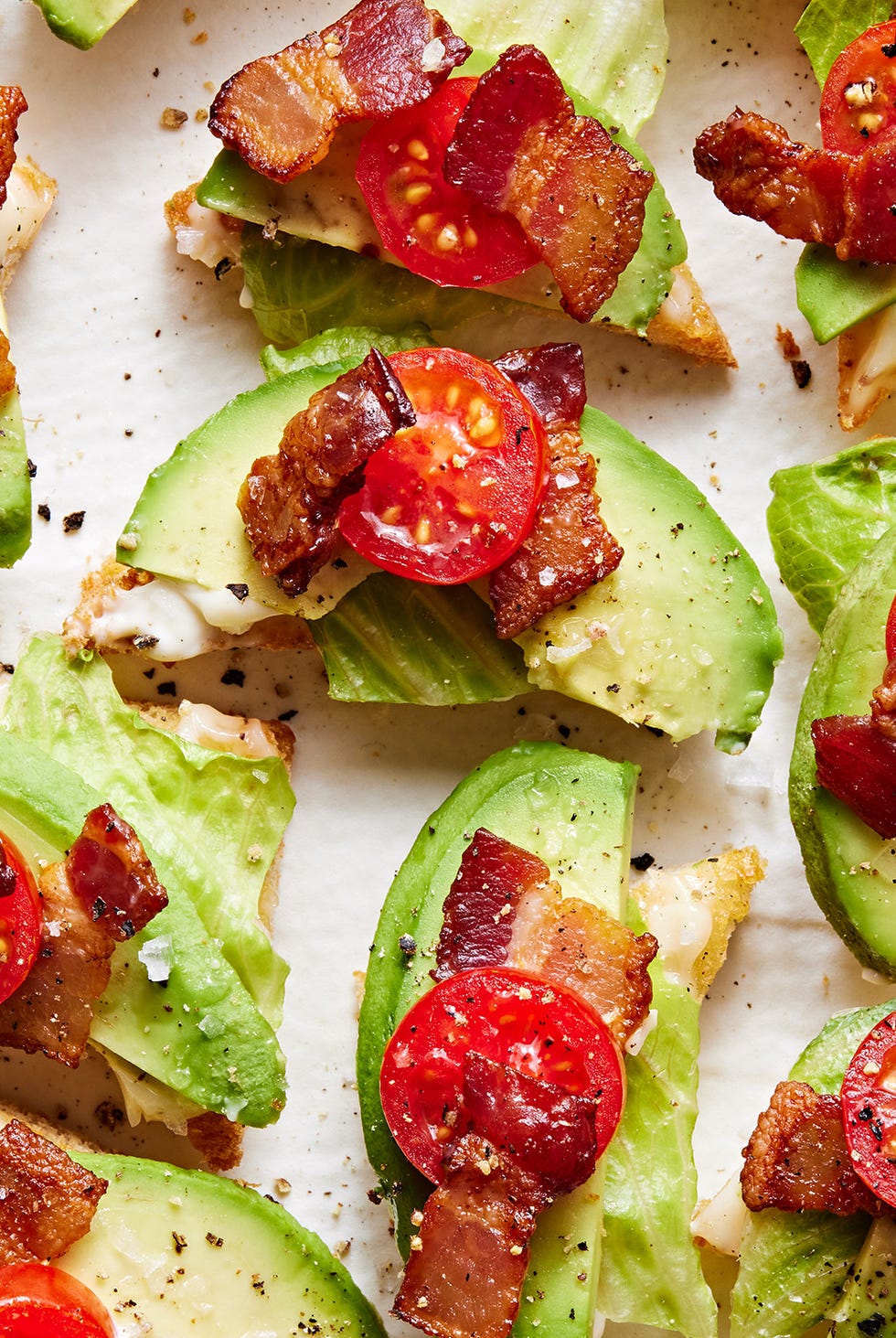 BLAT Toast White toast points topped with lettuce, avocado, lettuce and tomato