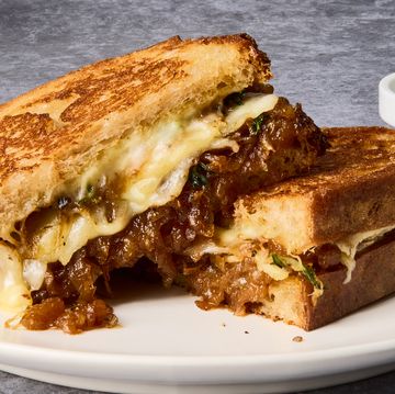 french onion grilled cheese sandwich on a white plate