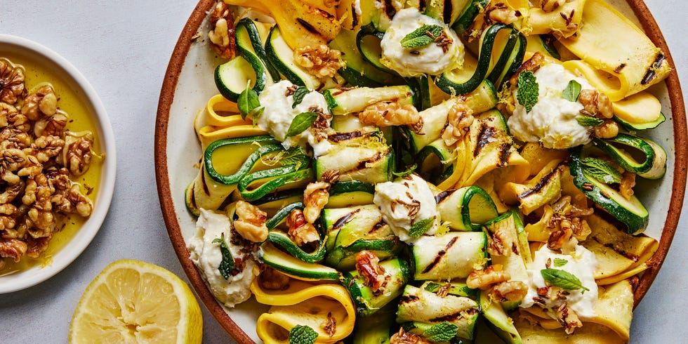 skewered and grilled zucchini planks topped with herby whipped ricotta and crunchy toasted walnuts