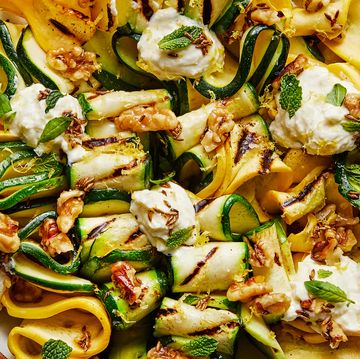 skewered and grilled zucchini planks topped with herby whipped ricotta and crunchy toasted walnuts