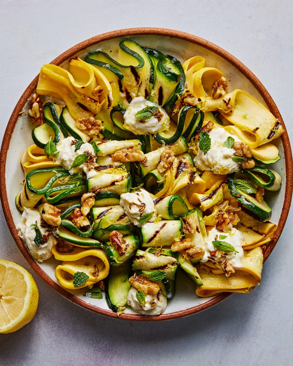 skewered and grilled zucchini planks topped with herby whipped ricotta and crunchy toasted walnuts
