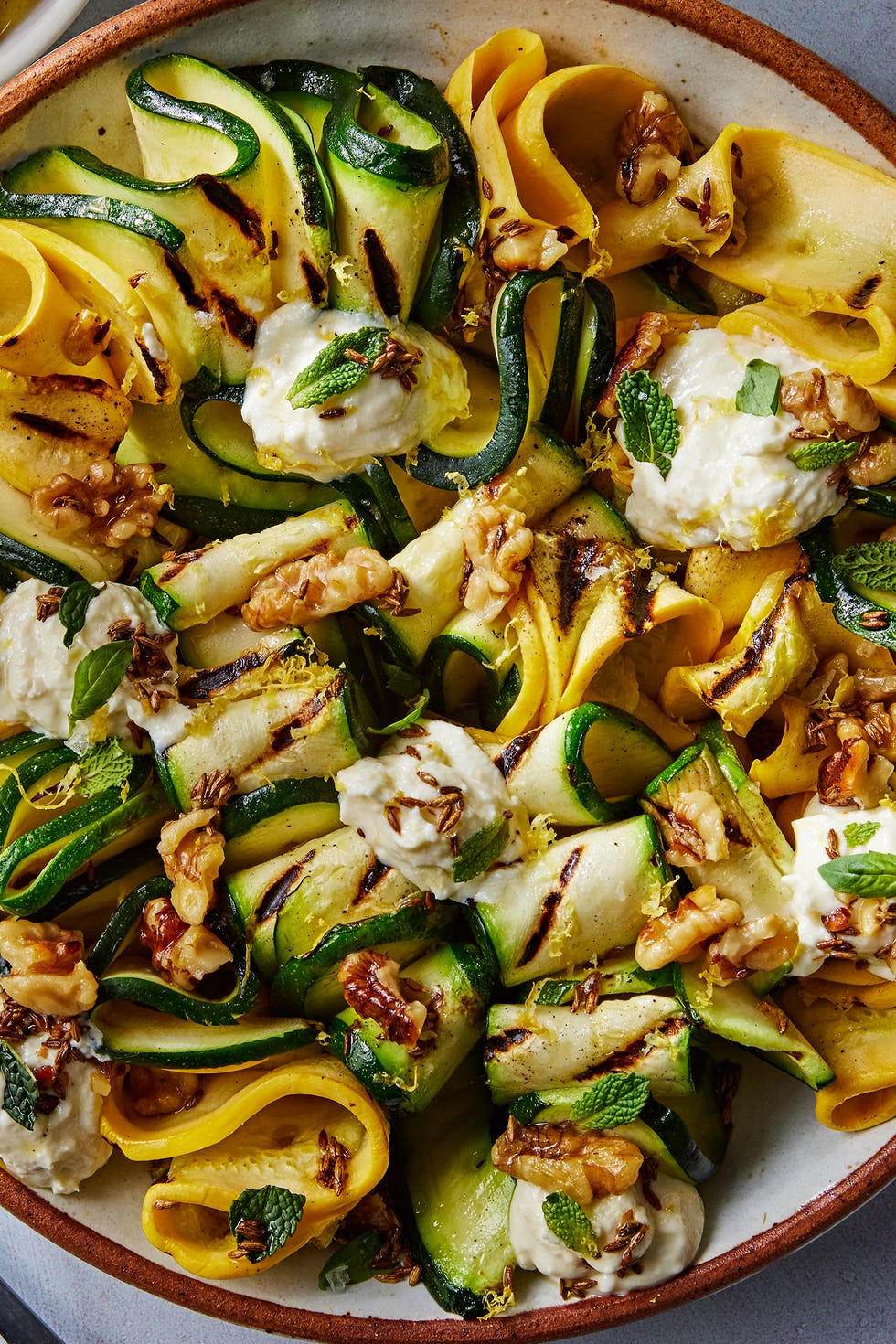 Grilled Zucchini w/ Ricotta & Walnuts skewered and grilled zucchini planks topped with herby whipped ricotta and crunchy toasted walnuts