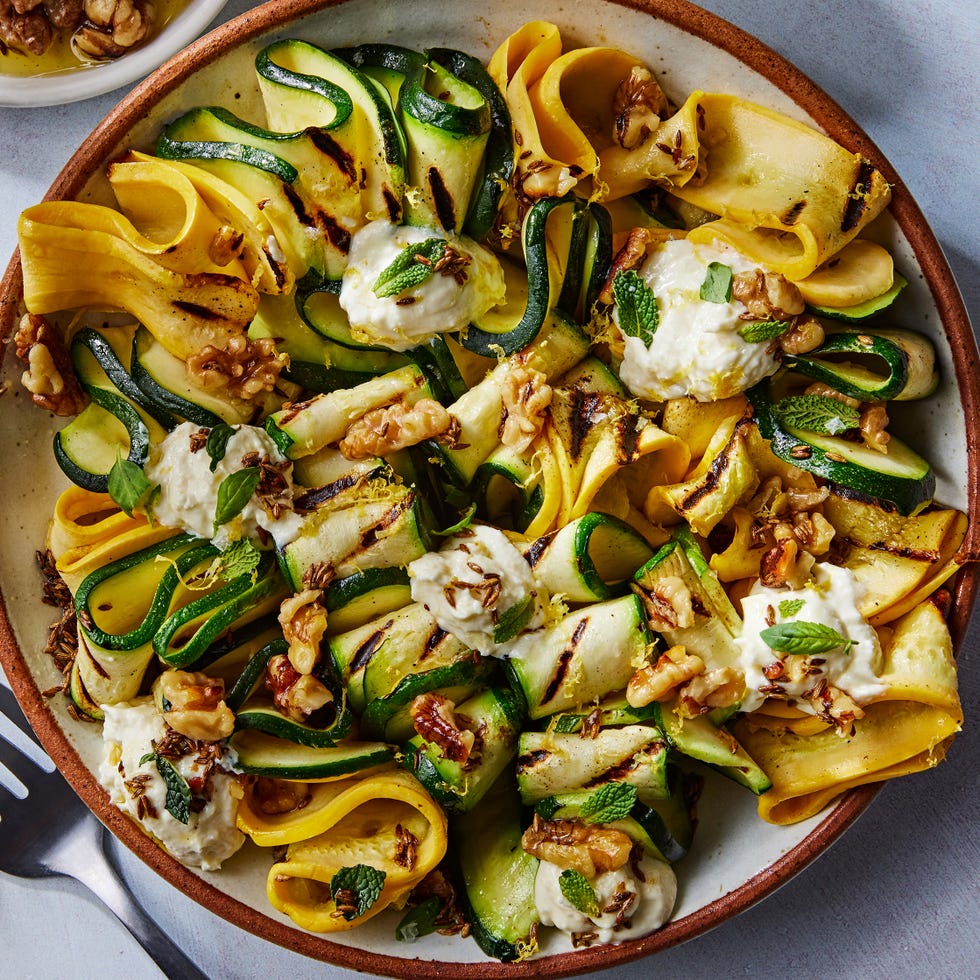 skewered and grilled zucchini planks topped with herby whipped ricotta and crunchy toasted walnuts