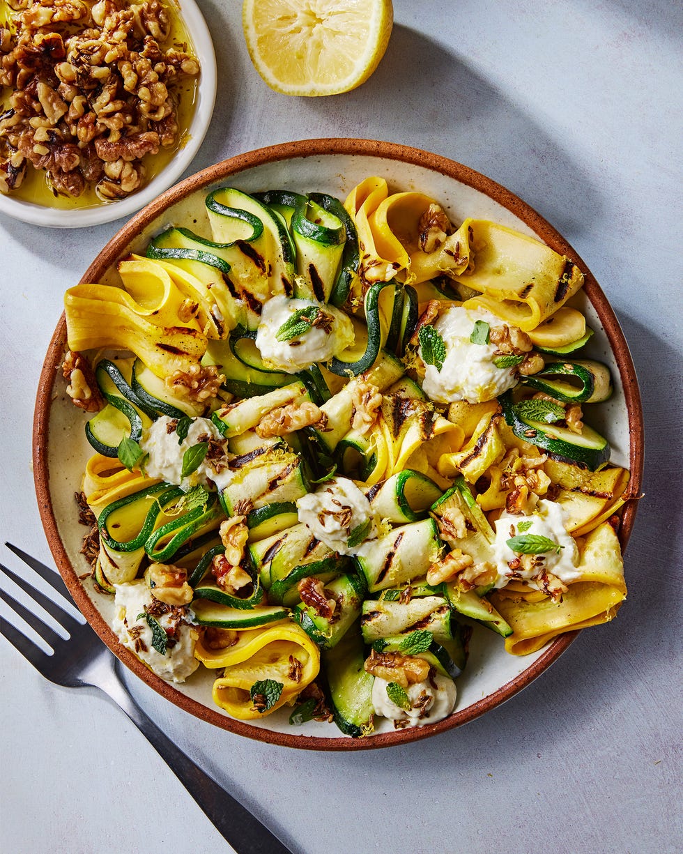 skewered and grilled zucchini planks topped with herby whipped ricotta and crunchy toasted walnuts