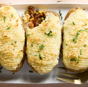 a saucy red wine spiked ground beef and vegetable mixture gets loaded into hollowed out russet potatoes, topped with parmesan mashed potatoes, and baked until golden brown