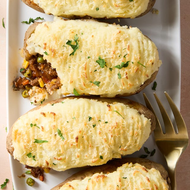 a saucy red wine spiked ground beef and vegetable mixture gets loaded into hollowed out russet potatoes, topped with parmesan mashed potatoes, and baked until golden brown