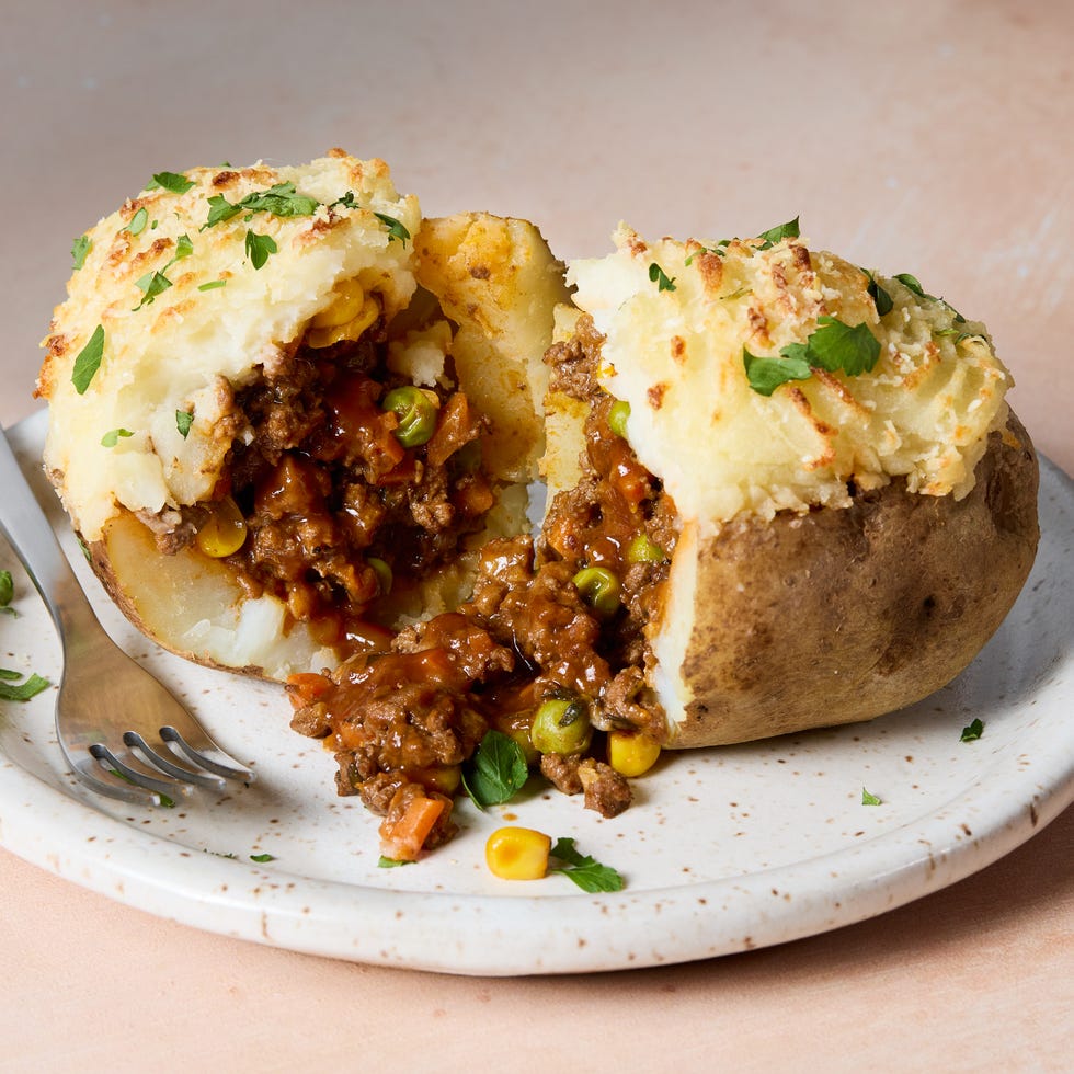 a saucy red wine spiked ground beef and vegetable mixture gets loaded into hollowed out russet potatoes, topped with parmesan mashed potatoes, and baked until golden brown
