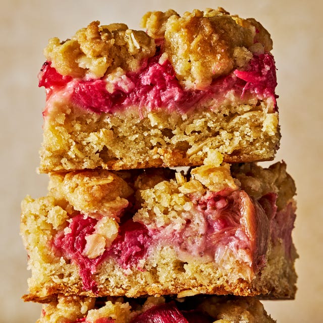 a stack of strawberry rhubarb crumble bars