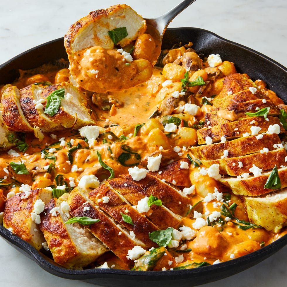 pillowy gnocchi in a creamy harissa sauce with ras al hanout spiced chicken, sliced mushrooms, spinach, and crumbled feta