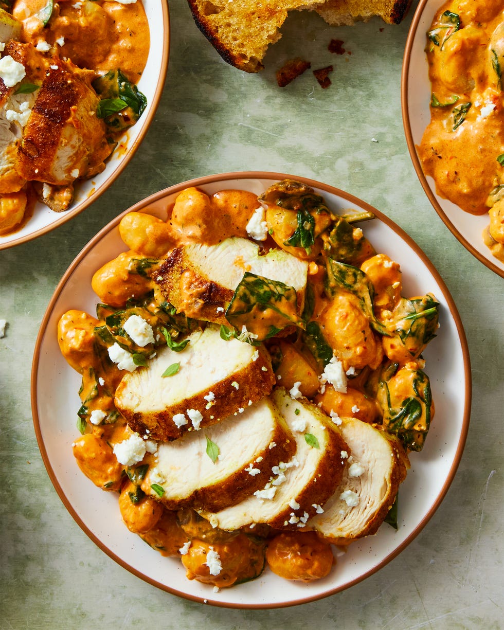 pillowy gnocchi in a creamy harissa sauce with ras al hanout spiced chicken, sliced mushrooms, spinach, and crumbled feta