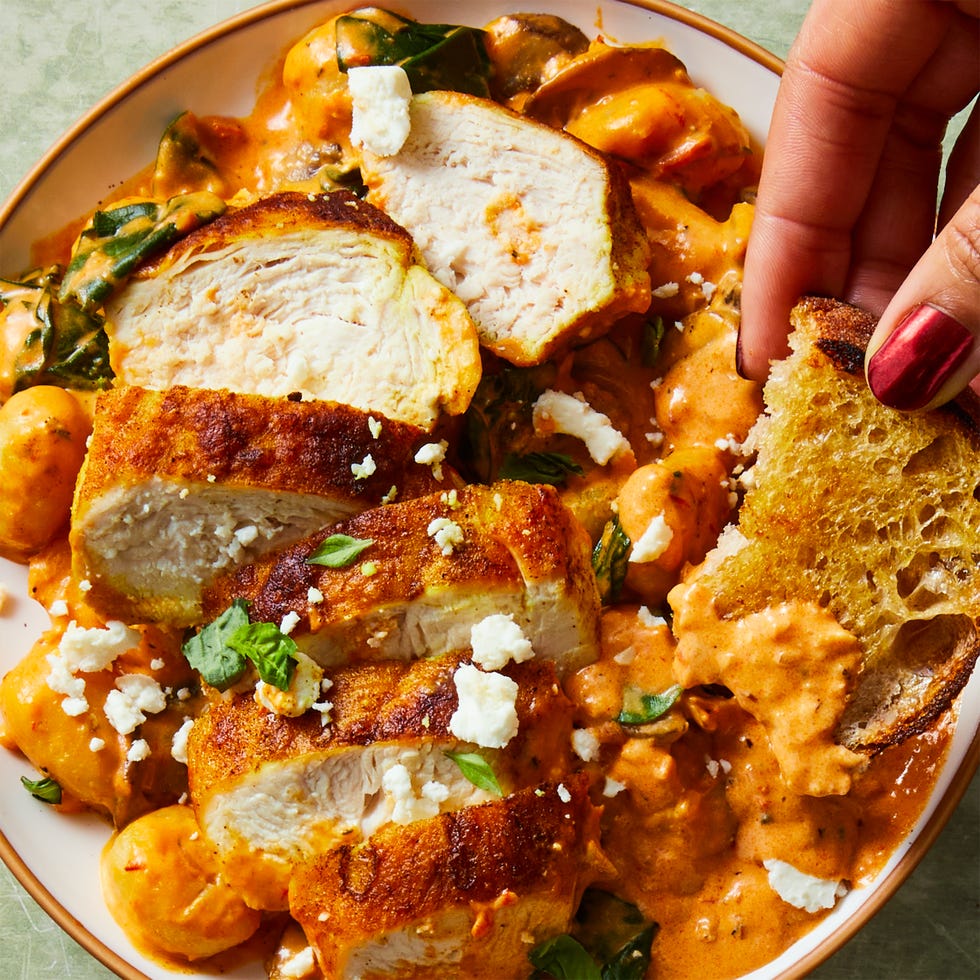 pillowy gnocchi in a creamy harissa sauce with ras al hanout spiced chicken, sliced mushrooms, spinach, and crumbled feta