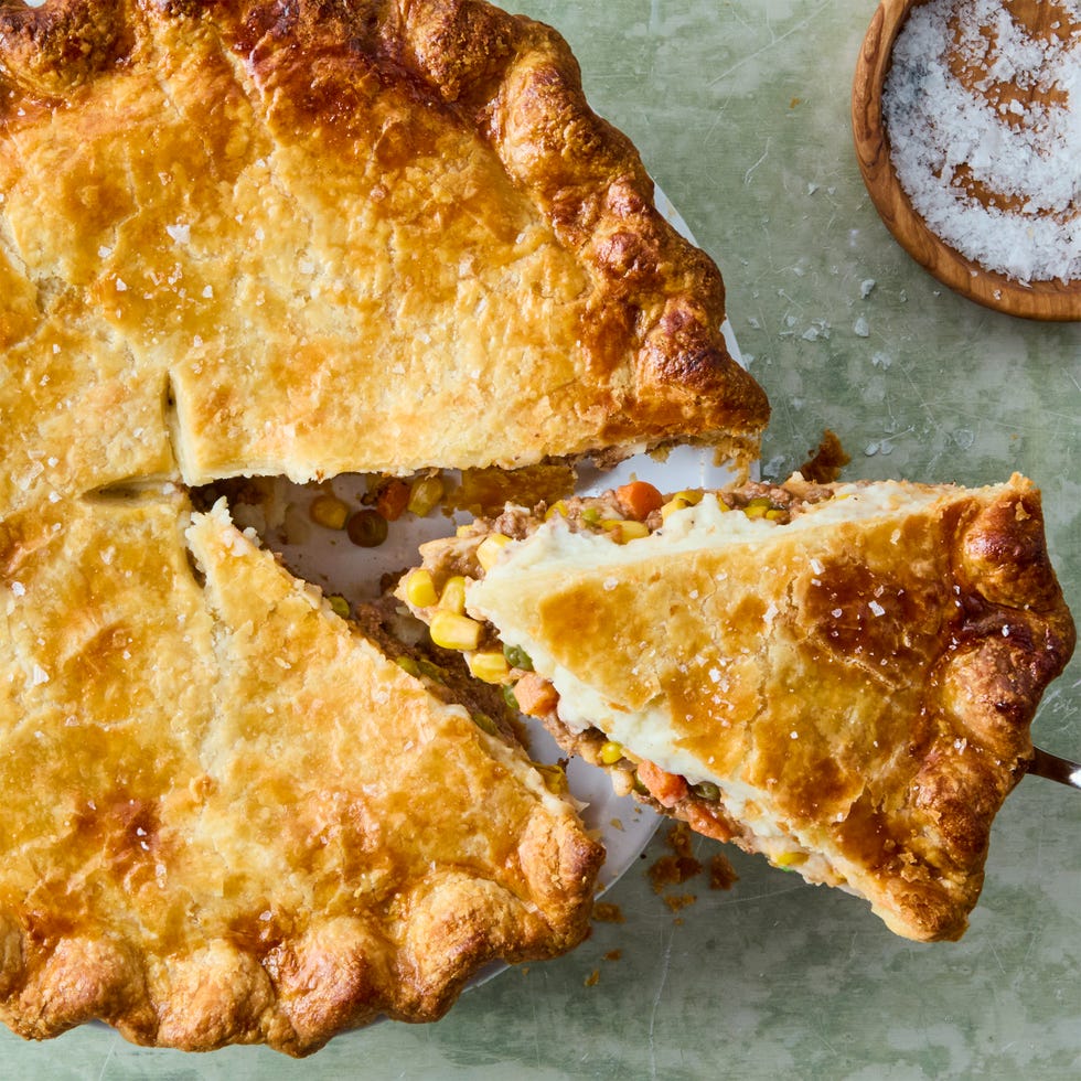 wine spiked ground beef and vegetable mixture topped with fluffy parmesan mashed potatoes, all wrapped in a golden brown pie crust and topped with flaky salt