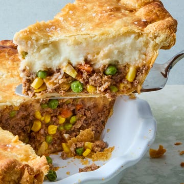 Shepherd's Pot Pie wine spiked ground beef and vegetable mixture topped with fluffy parmesan mashed potatoes, all wrapped in a golden brown pie crust and topped with flaky salt
