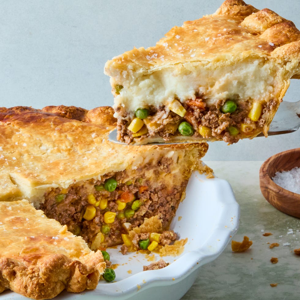 wine spiked ground beef and vegetable mixture topped with fluffy parmesan mashed potatoes, all wrapped in a golden brown pie crust and topped with flaky salt