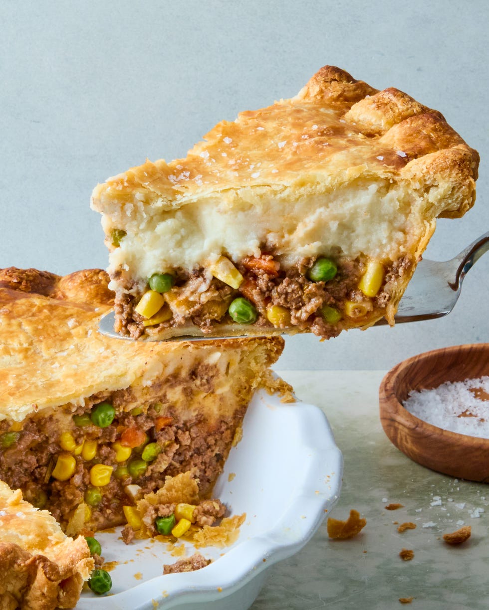 wine spiked ground beef and vegetable mixture topped with fluffy parmesan mashed potatoes, all wrapped in a golden brown pie crust and topped with flaky salt