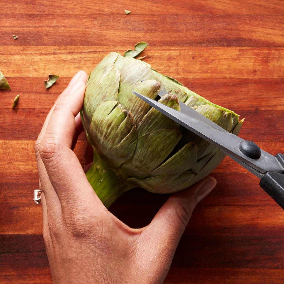 trimming artichoke from thorns