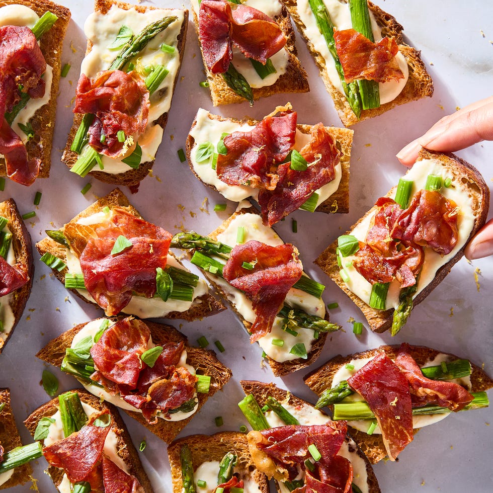 mini toasted sourdough with fluffy whipped ricotta, roasted asparagus, and crispy prosciutto