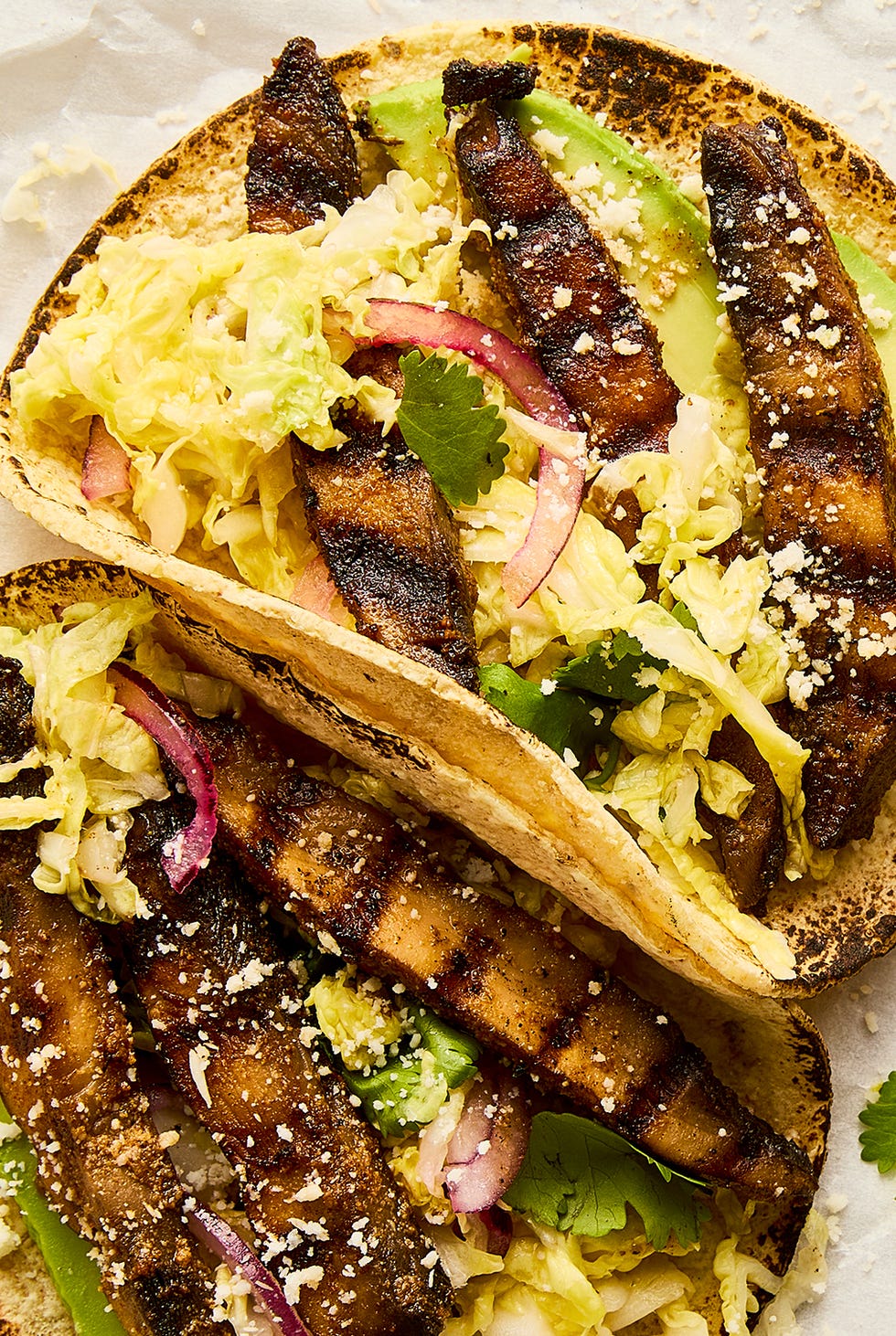Grilled portobello tacos grilled portobello tacos topped with cabbage slaw, avocado, and queso fresco