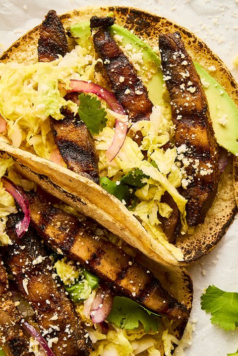 grilled portobello tacos topped with cabbage slaw, avocado, and queso fresco