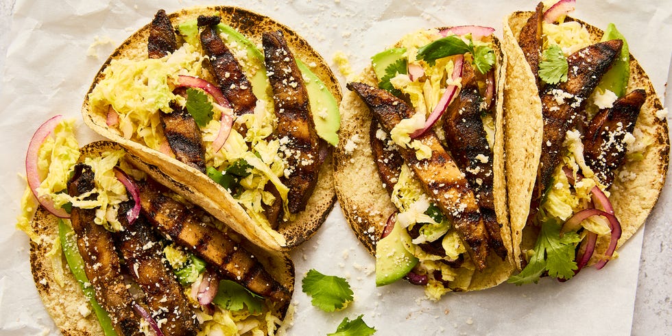 grilled portobello tacos topped with cabbage slaw, avocado, and queso fresco