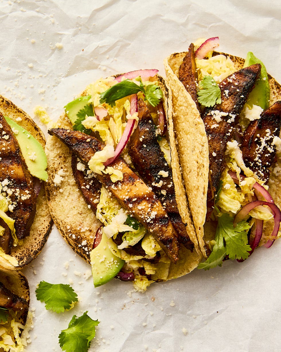 grilled portobello tacos topped with cabbage slaw, avocado, and queso fresco