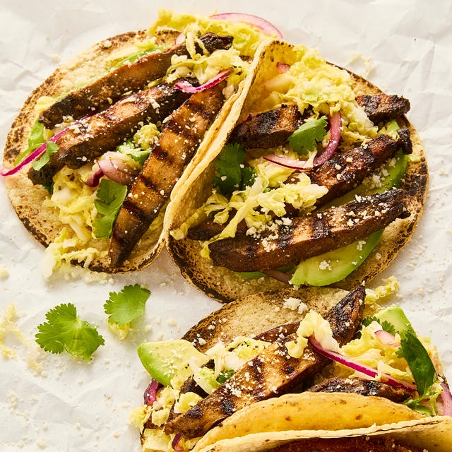 grilled portobello tacos topped with cabbage slaw, avocado, and queso fresco