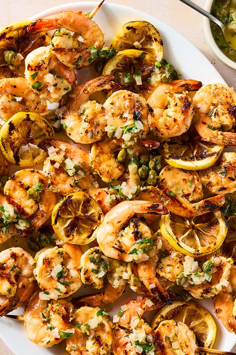 juicy, charred shrimp, bright lemon zest, briny capers, and white wine butter sauce