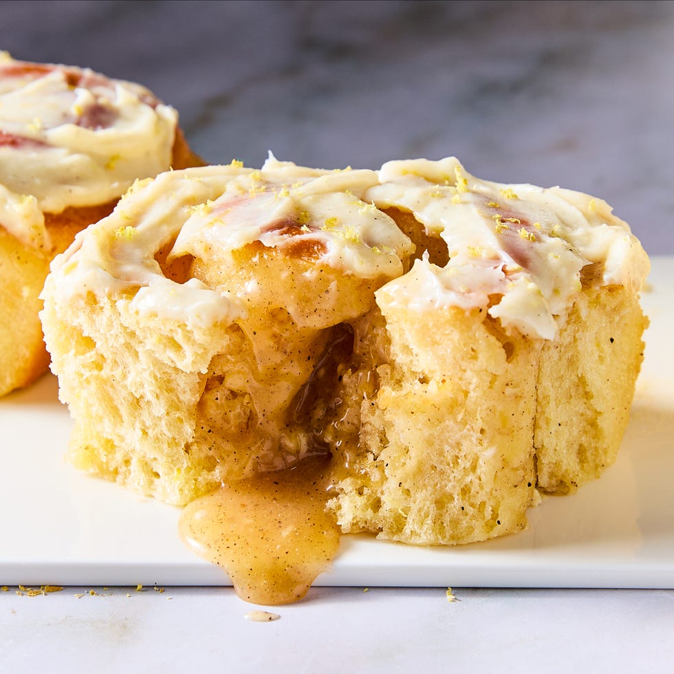 pillowy soft rolls stuffed with a lemon curd filling studded with ground cardamom and freshly grated ginger, and topped with fluffy cream cheese frosting
