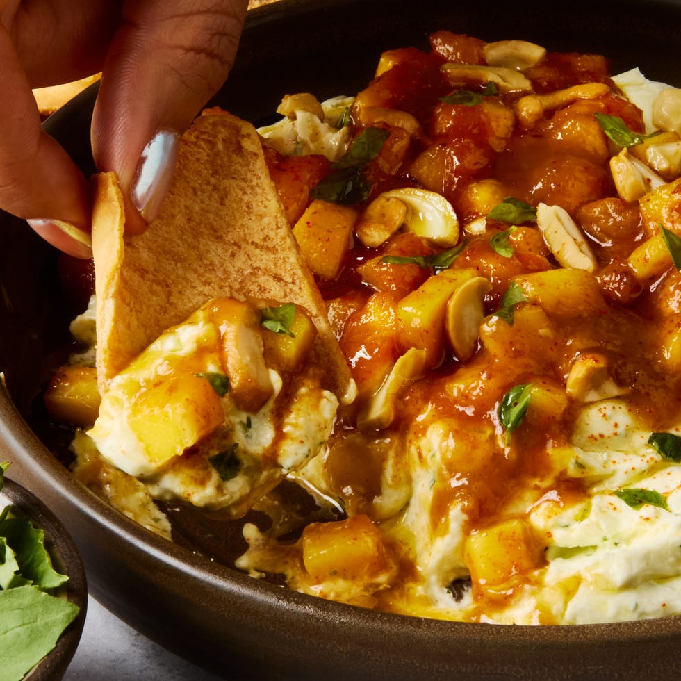 fluffy garlic and basil studded whipped goat cheese, spicy mango chutney, and salty chopped cashews served with pita chips