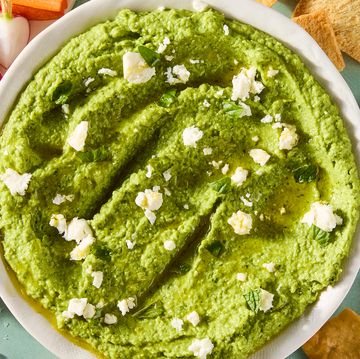 sweet spring peas are blanched until tender yet vibrant green, then blended with tangy feta cheese, basil, mint, and lemon for a luscious dip that's both creamy and savory
