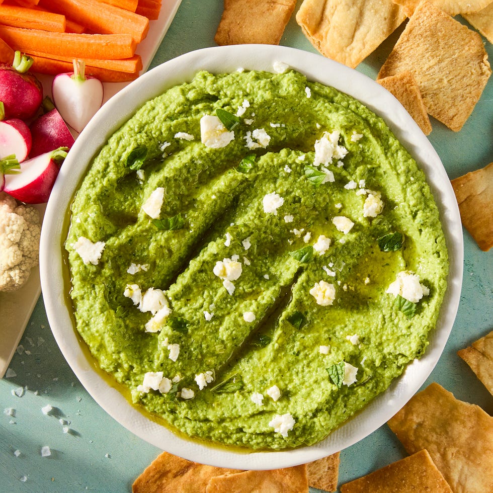 sweet spring peas are blanched until tender yet vibrant green, then blended with tangy feta cheese, basil, mint, and lemon for a luscious dip that's both creamy and savory