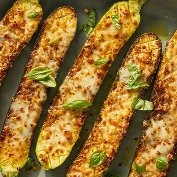 Cheesy garlic zucchini steaks cheesy garlic zucchini steaks on a greek plate topped with basil and red pepper flakes