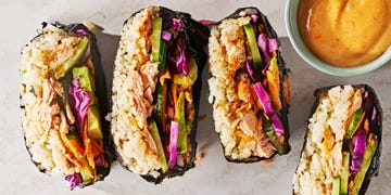 spicy salmon, seasoned sushi rice, cucumber, pickled cabbage, carrot, and avocado, all wrapped in nori and served with sriracha soy mayo