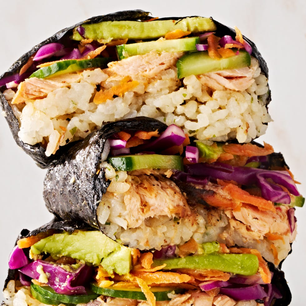 spicy salmon, seasoned sushi rice, cucumber, pickled cabbage, carrot, and avocado all wrapped in nori and served with sriracha soy mayo
