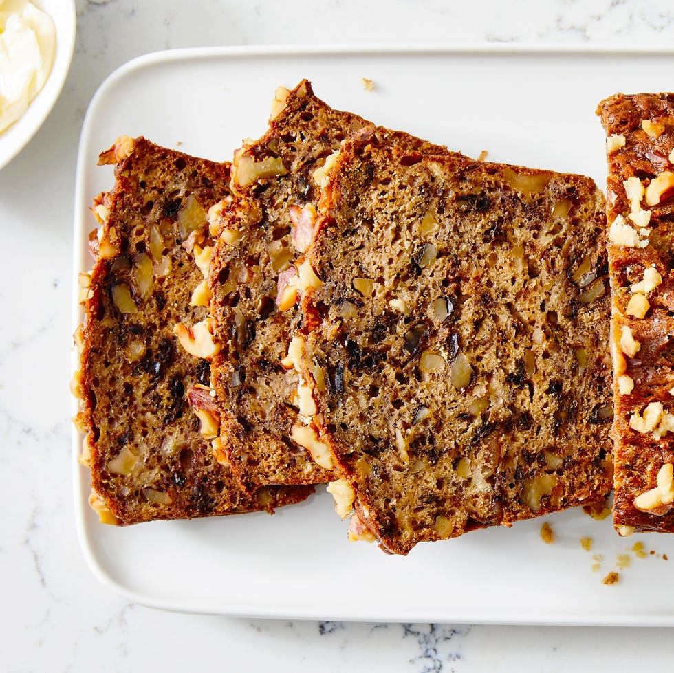 banana nut bread slices on a white platter