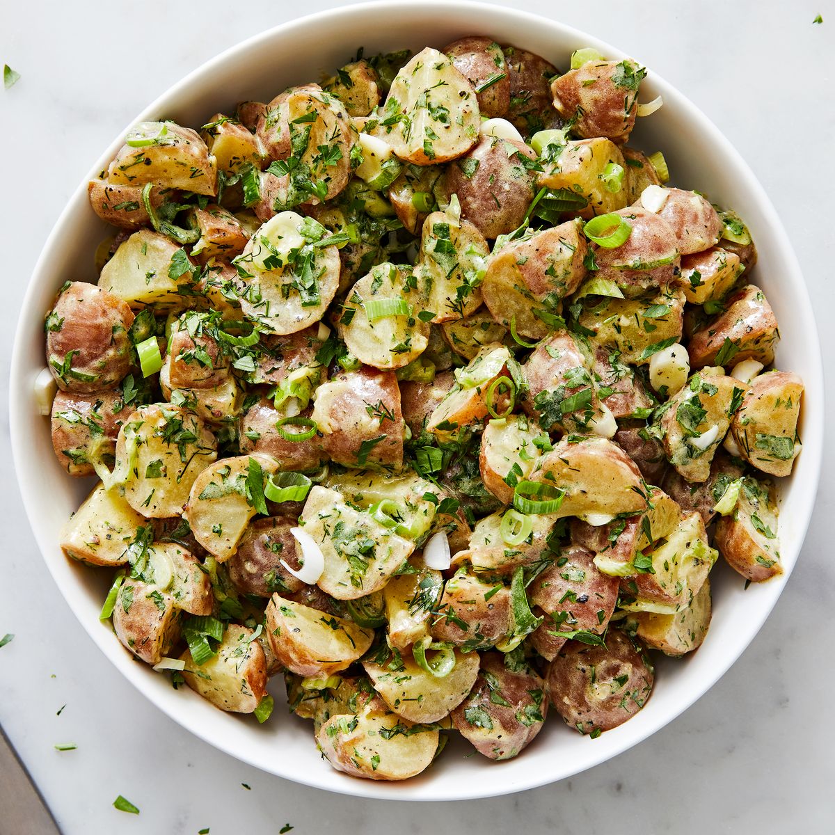 baby red potatoes tossed in garlic mustard dressing with parsley dill and tarragon