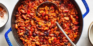 hearty, creamy beans are cooked with bacon, ground beef, aromatics, and pickled jalapenos in a sweet, slightly spicy, and tangy sauce