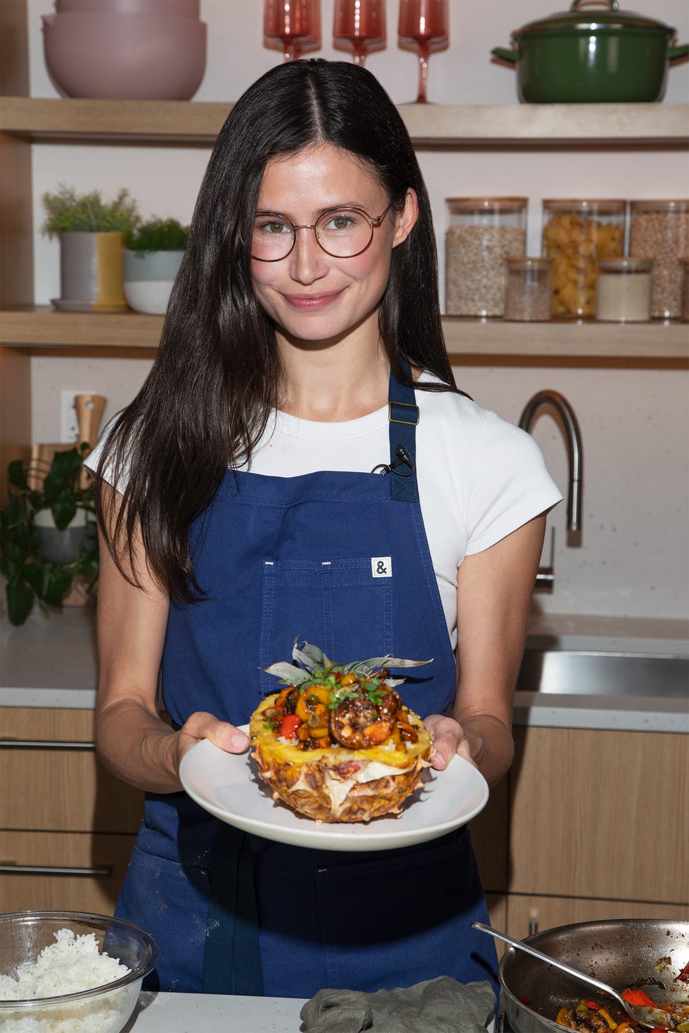 a woman holding a plate of food