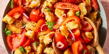 panzanella salad in a bowl with shallots and basil