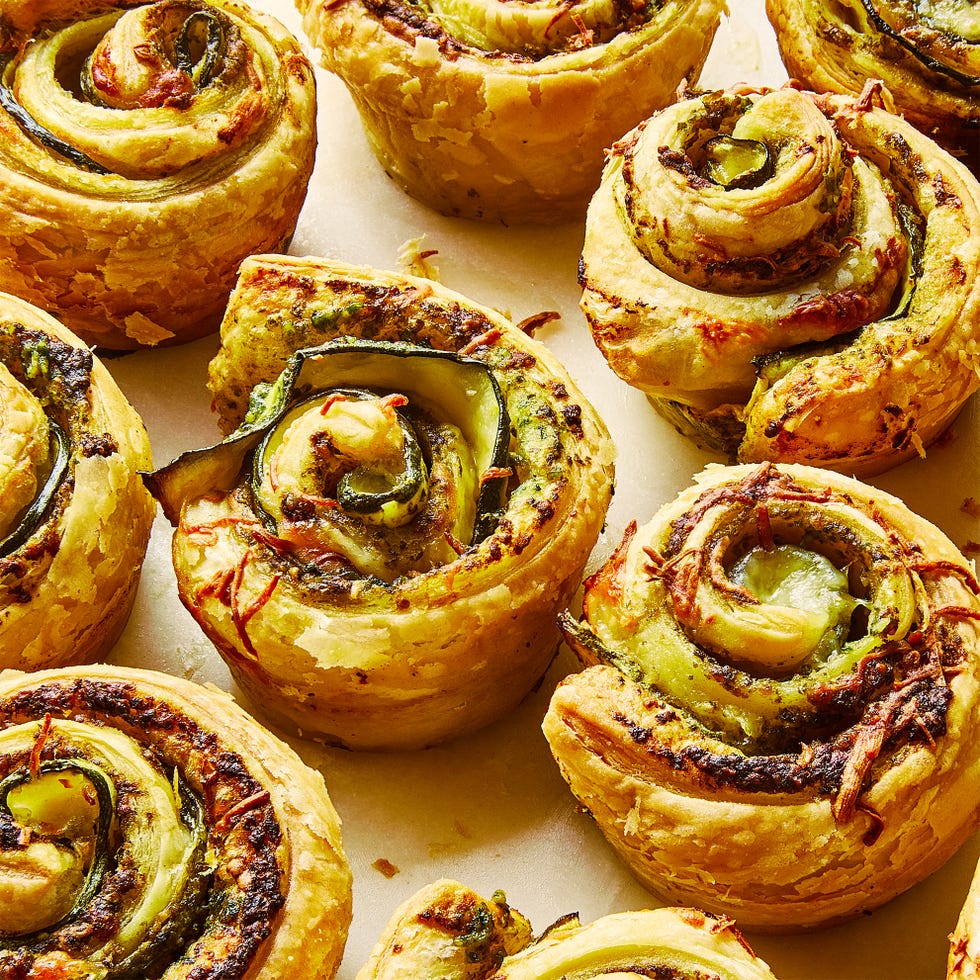 pesto zucchini roses on a white surface