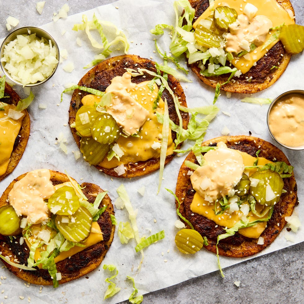 the ultimate comfort food hybrid with a crispy, juicy, thin beef patty, melty american cheese, and all the classic burger fixings loaded onto a toasted flour tortilla