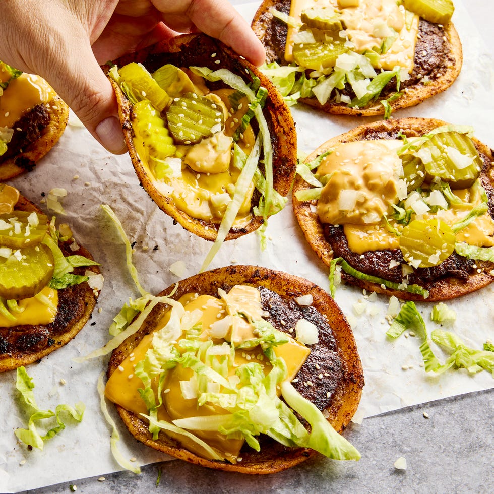 the ultimate comfort food hybrid with a crispy, juicy, thin beef patty, melty american cheese, and all the classic burger fixings loaded onto a toasted flour tortilla