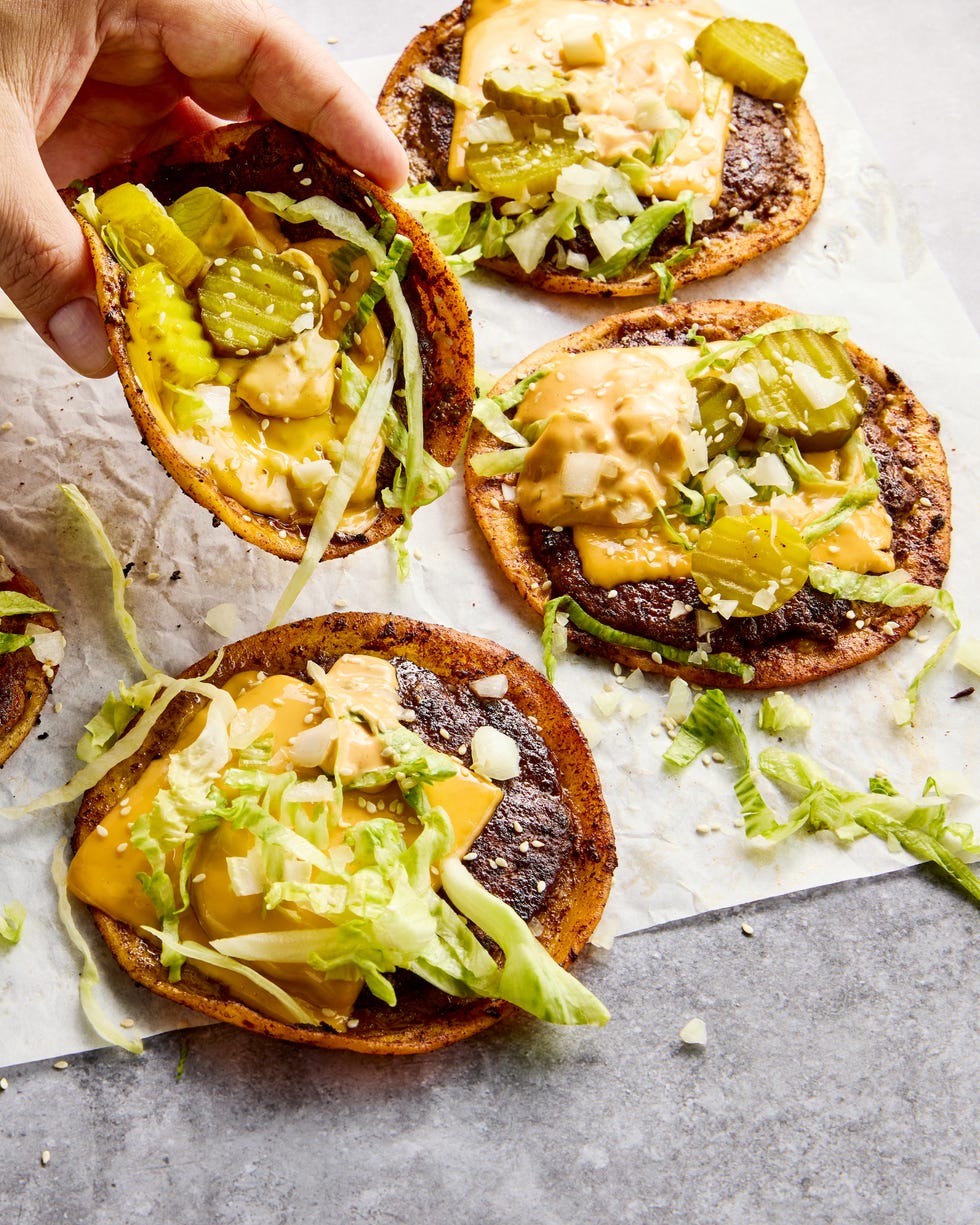 The ultimate comfort food hybrid: a crispy, juicy thin beef patty, melted American cheese, and all the classic burger fixings stuffed into a toasted flour tortilla.