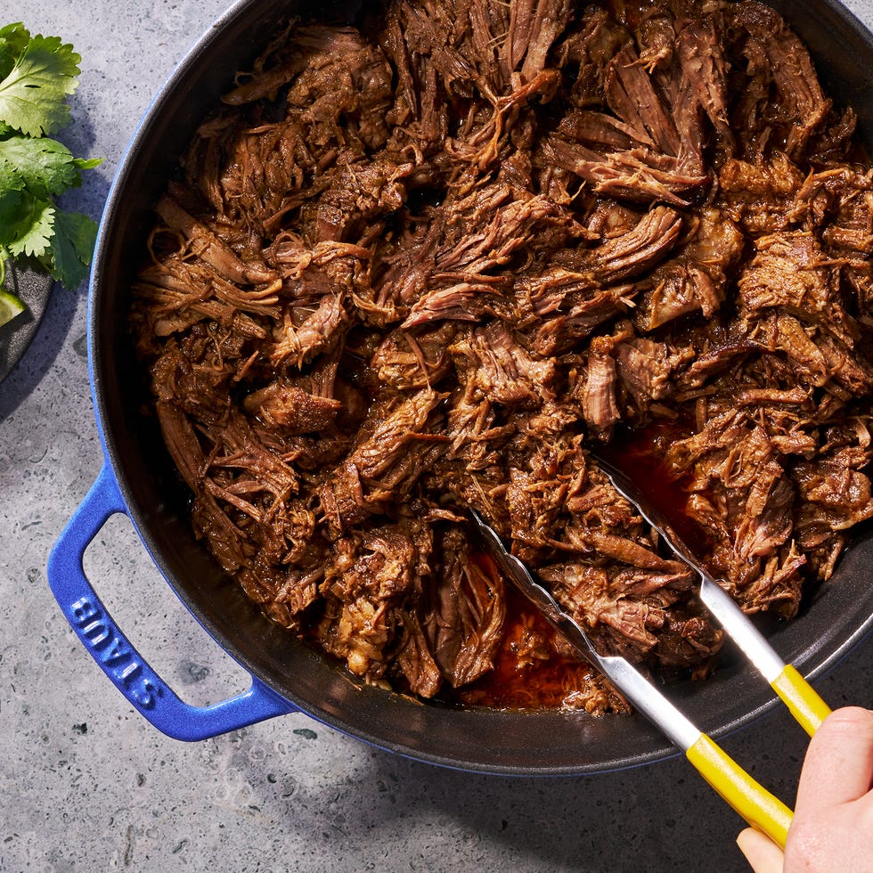 marbled beef chuck seasoned with chili powder and cumin then seared and braised in a beef broth flavored with chipotle chili sauce, scallion, garlic, and fresh herbs until fork tender